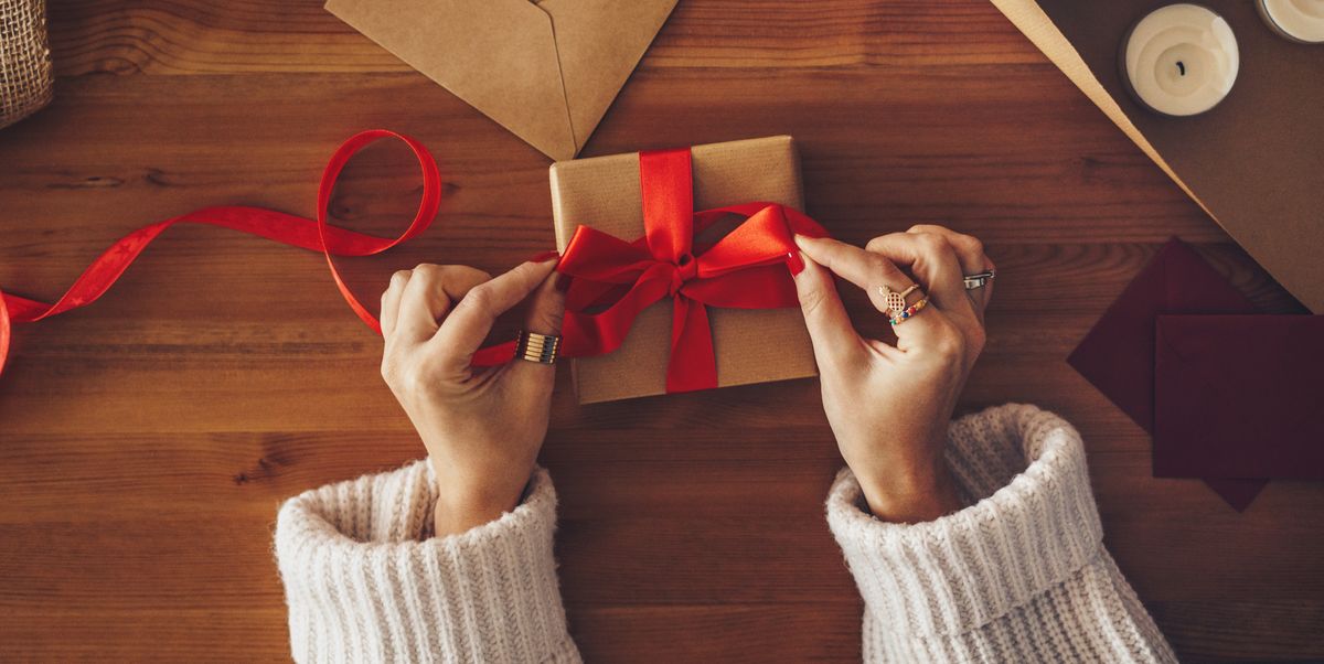 woman-wrapping-a-christmas-present-royalty-free-image-1608157347.